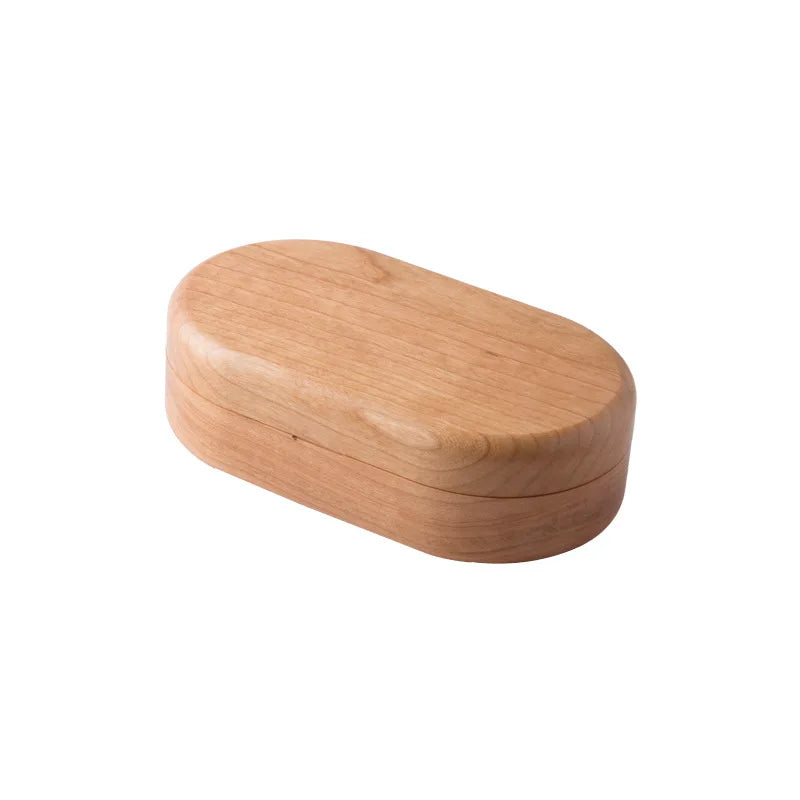 Elegant oval mini wooden jewellery box featuring a rich walnut finish and soft velvet lining for organizing accessories. Compact design perfect for travel or small spaces. 6