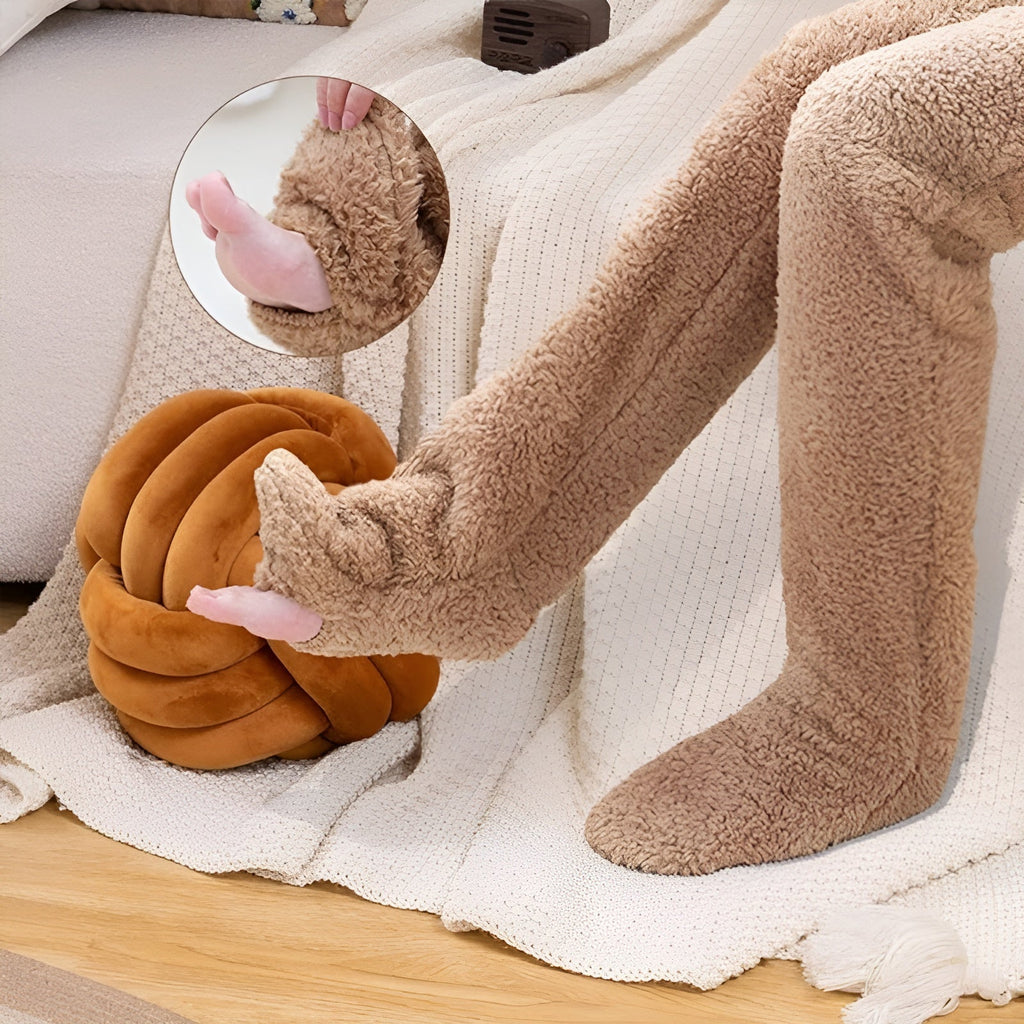 Cozy over-the-knee socks made from soft, warm fabric, perfect for winter. Available in various colors, these stylish accessories feature a snug fit 2