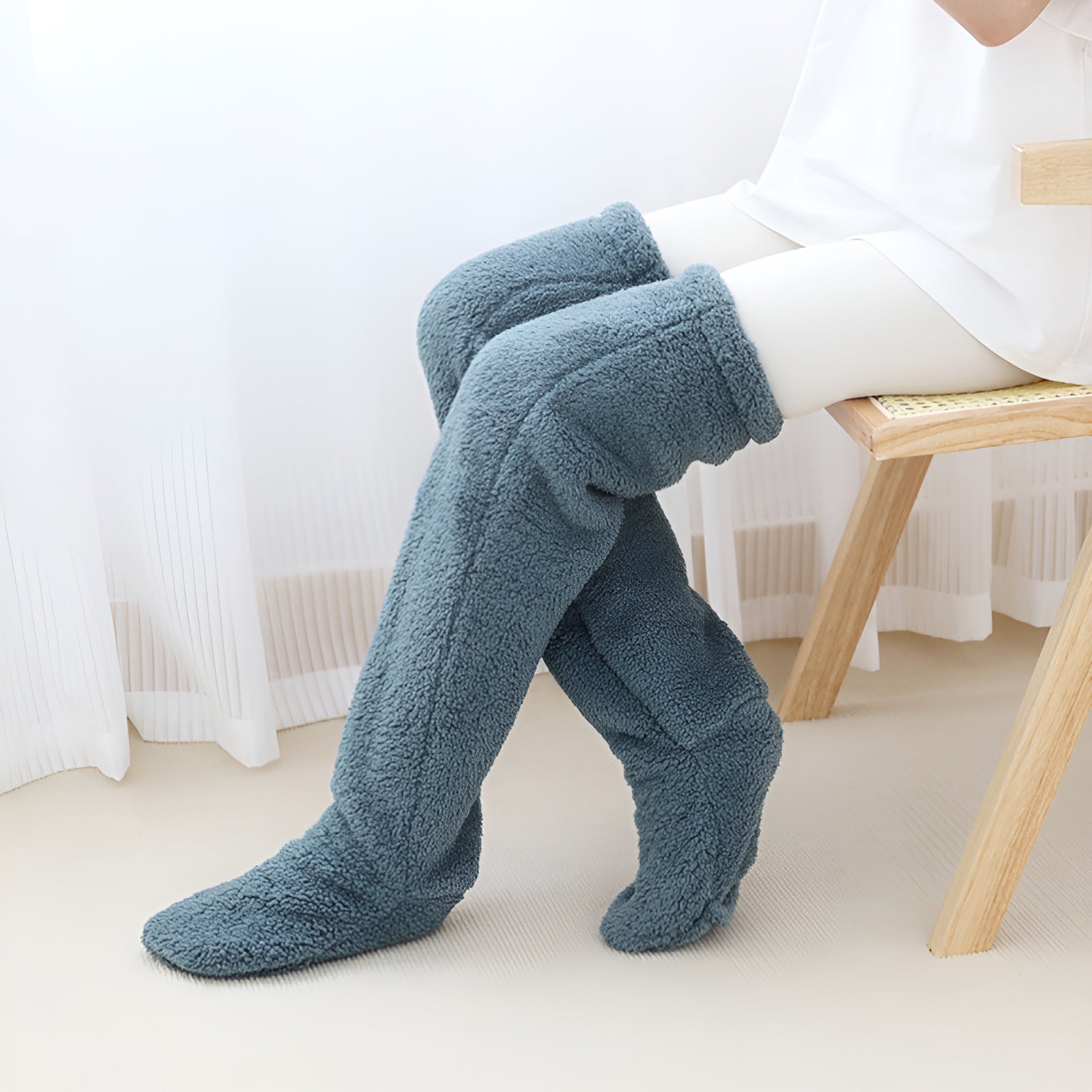 Cozy over-the-knee socks made from soft, warm material, perfect for winter. Available in various colors, these stylish accessories add comfort and flair 3
