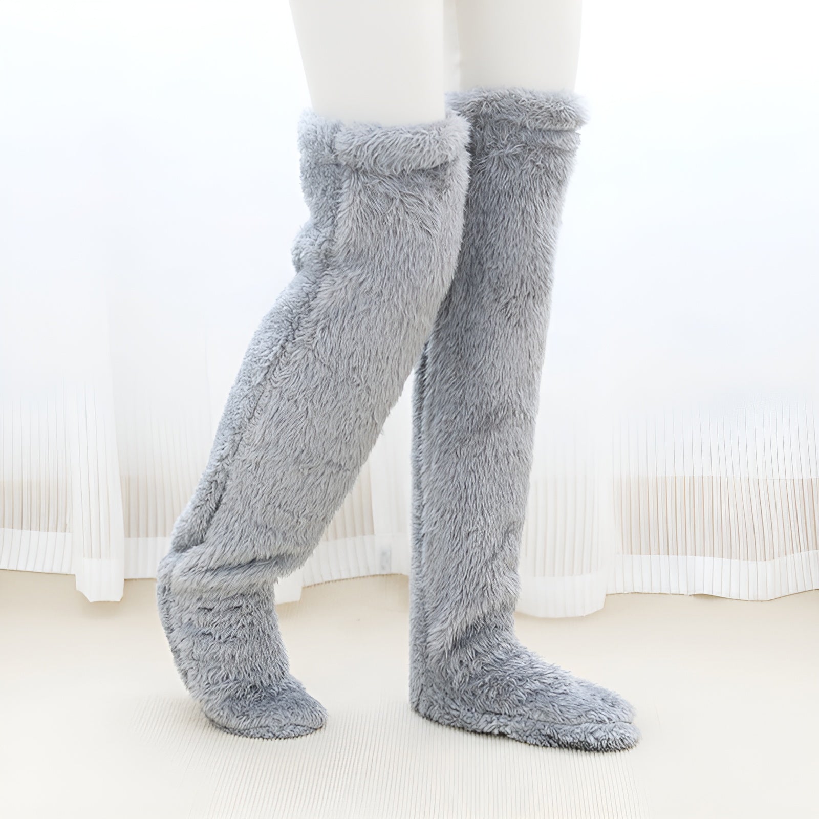 Cozy over-the-knee socks made from soft, stretchy fabric, perfect for winter. Available in various colors, these stylish accessories provide warmth and comfort 6