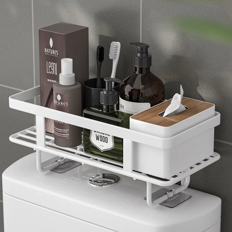 White wrought iron over-the-toilet storage shelf featuring a multi-layer design for optimal space efficiency. Ideal for organizing bathroom essentials, it combines elegance with functionality 1