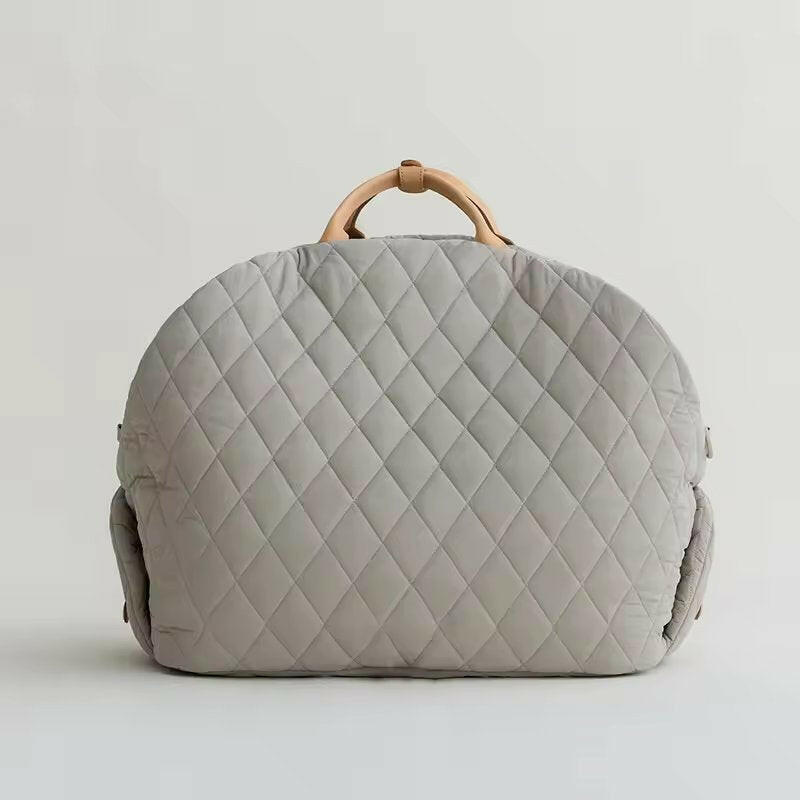 Beige quilted fabric pet carrier, versatile 2-in-1 design for car seat and carrier. Measures 17.3 x 13. 9