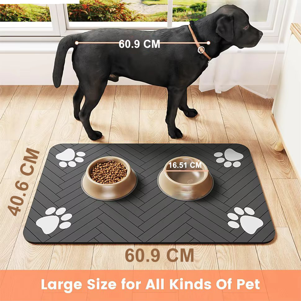 Charcoal grey waterproof rubber pet feeding mat featuring playful paw-print accents. Designed for non-slip stability and easy cleaning, available in small and large sizes to 1