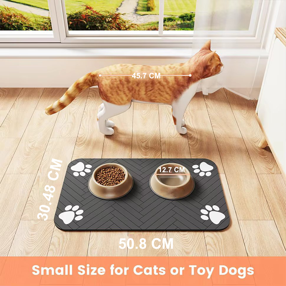Charcoal grey waterproof rubber pet feeding mat featuring playful paw-print accents. Non-slip design ensures stability during feeding, while easy-to-clean surface makes maintenance a 2