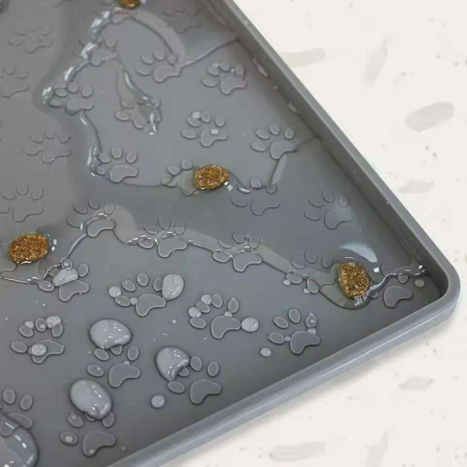 Waterproof silicone pet food mat in a sleek design, featuring a non-slip surface for stability. Available in multiple sizes and colors, measuring 15. 6