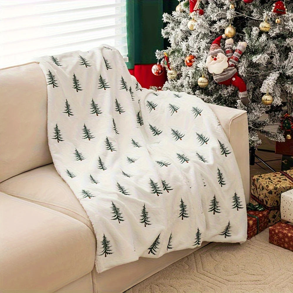 Cozy white blanket featuring a festive Christmas tree print, perfect for holiday decor. Made from plush fabric for warmth and comfort, ideal for snuggling up 0