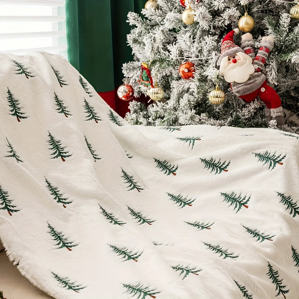 Cozy white blanket featuring a festive Christmas tree print, perfect for holiday decor. Made from plush fabric for warmth and comfort, ideal for snuggling up 3