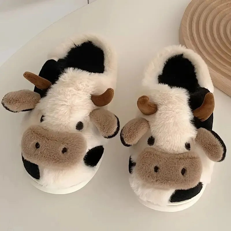 Cozy plush unisex slippers featuring a trendy cow motif, crafted from soft, durable materials. These stylish slippers are perfect for indoor wear, offering comfort 2