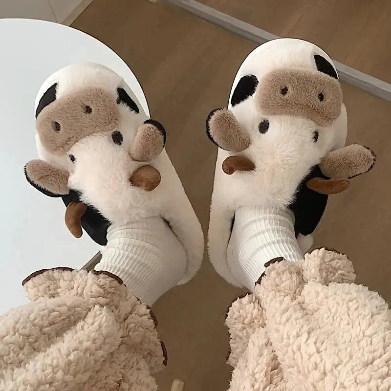 Cozy plush unisex slippers featuring a trendy cow motif, crafted from soft, high-quality material. The slippers are designed for ultimate comfort, with a 5