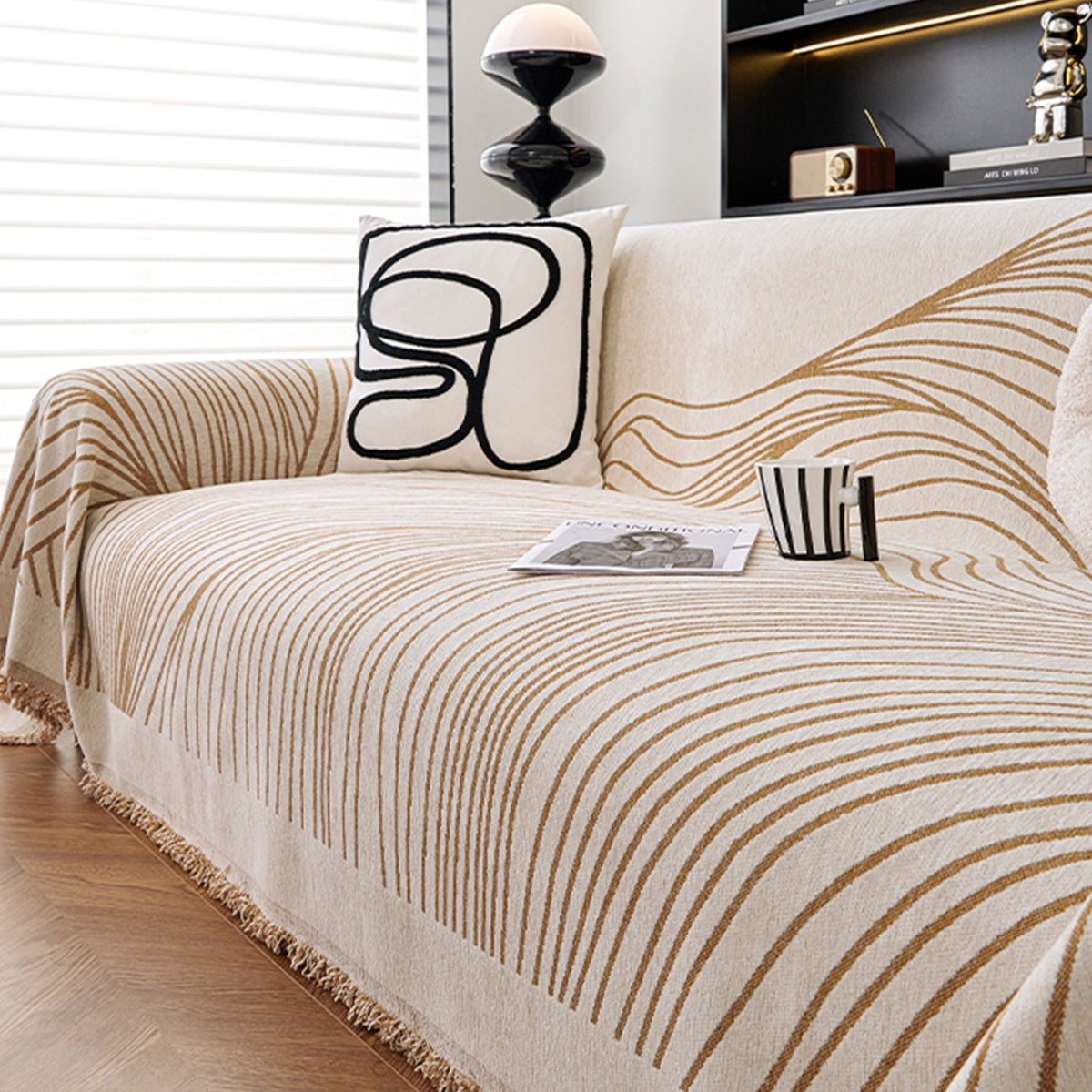 Reversible jacquard sofa cover in soft gray and cream, featuring an intricate woven pattern. Made from durable, pet-friendly fabric, it effortlessly protects 5