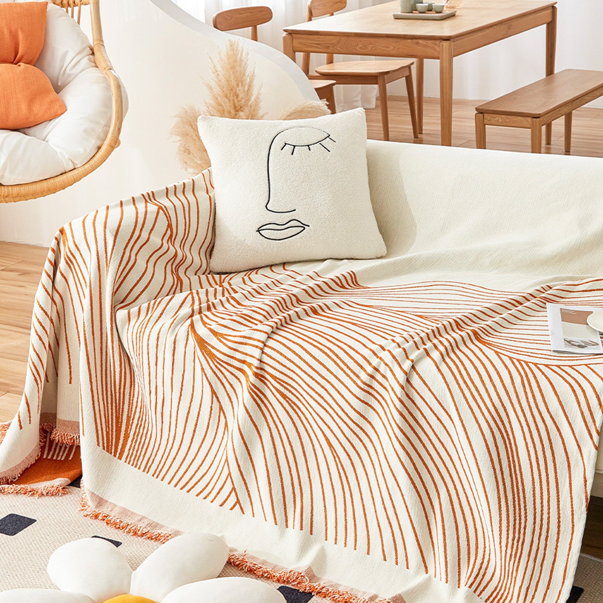 Reversible jacquard sofa cover in soft gray and cream, featuring an intricate woven pattern. Made from durable, pet-friendly fabric, it effortlessly protects 6