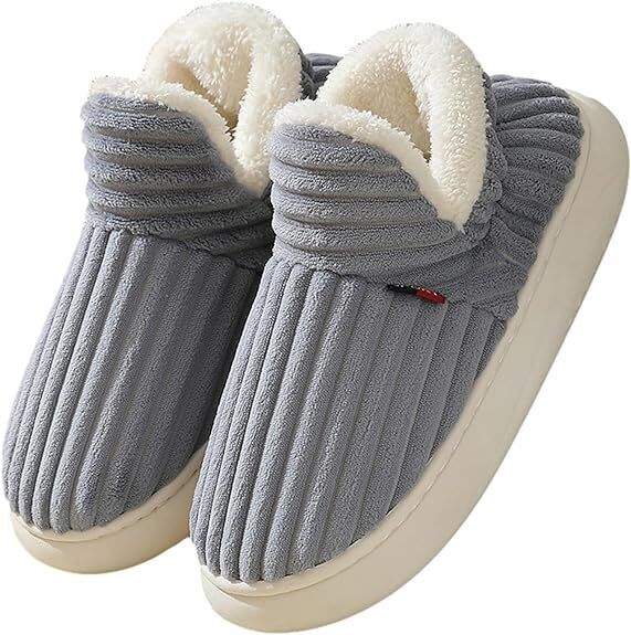 Cozy beige ribbed fabric women's slippers featuring a stylish design. Perfect for indoor wear, these slippers provide comfort and warmth with a soft, textured finish 3