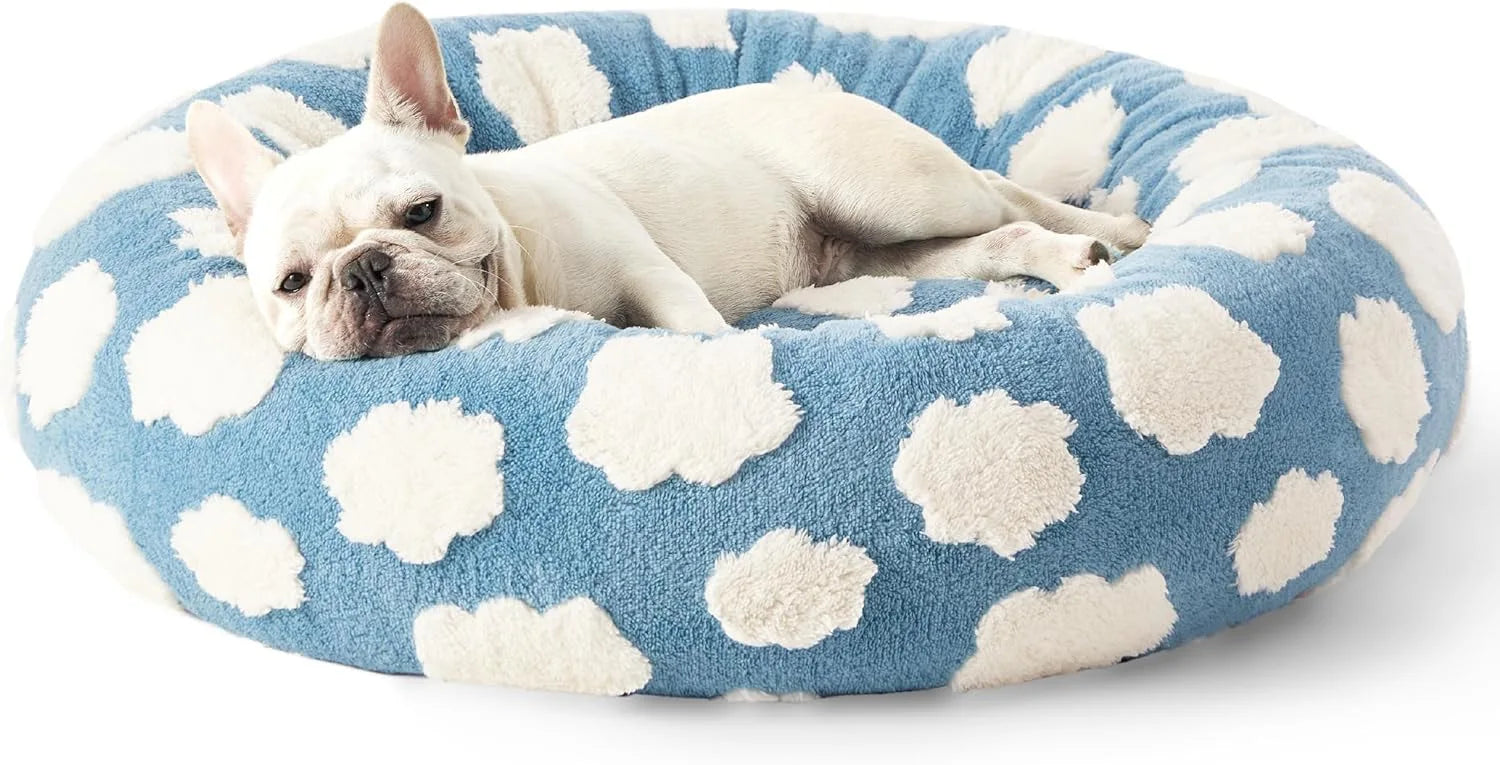 Round soft cozy pet bed for dogs and cats in a neutral grey color. Made from plush fabric, it features a thick, cushioned rim for support 5