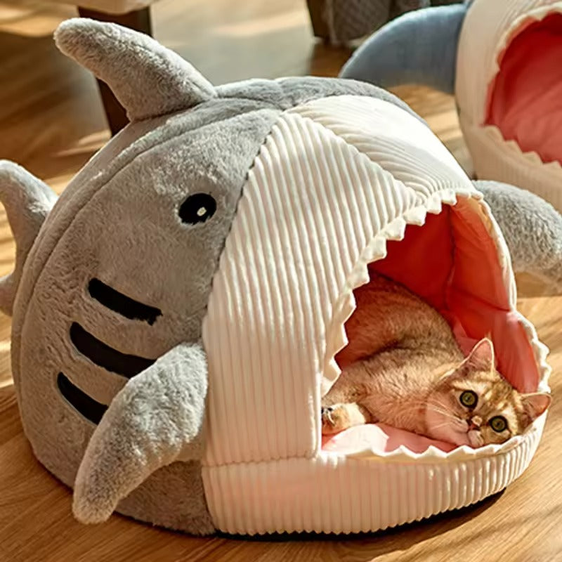 Shark-shaped cat bed made from soft corduroy and plush materials, offering a cozy cave-like space for pets. Available in three sizes, featuring 6