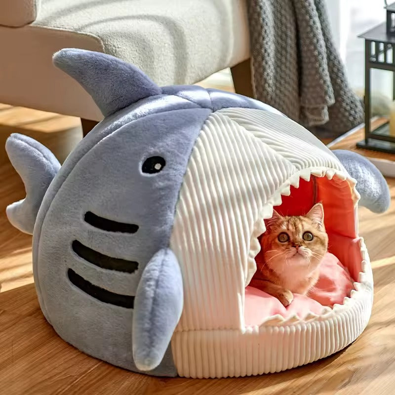 Shark-shaped cat bed made of soft corduroy and plush material, featuring a cozy cave design. Available in three sizes, it is perfect for 7
