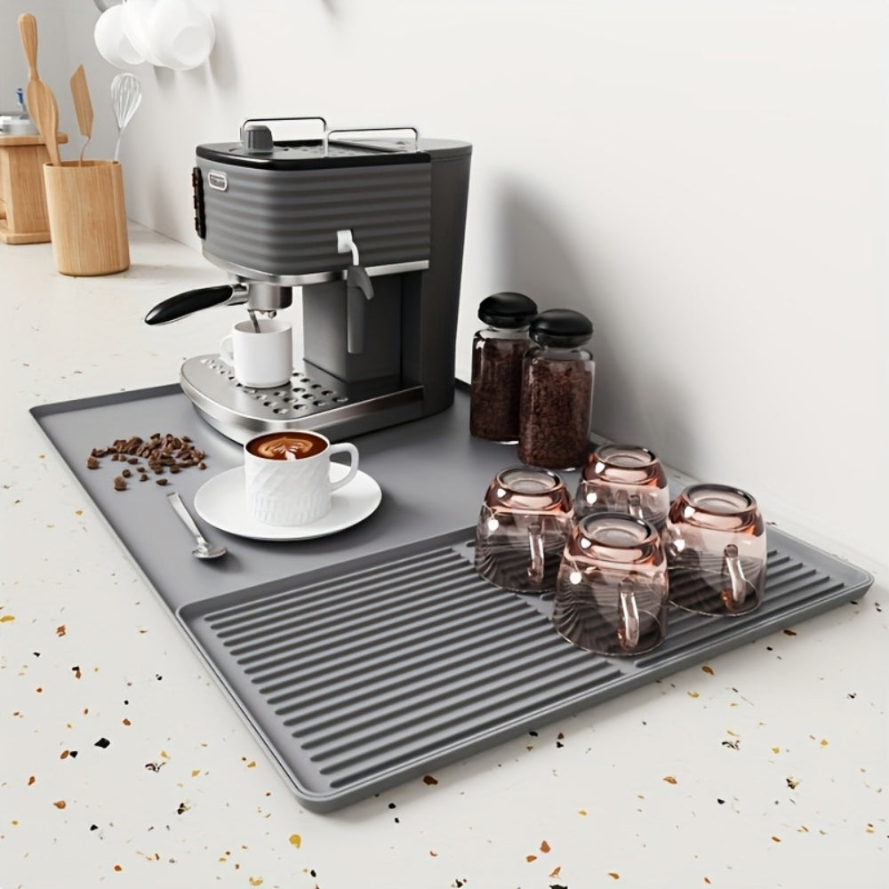 Black silicone coffee bar mat featuring a sleek, modern design. Heat-resistant and waterproof, it provides a durable surface for coffee setups, ensuring easy cleanup and 2