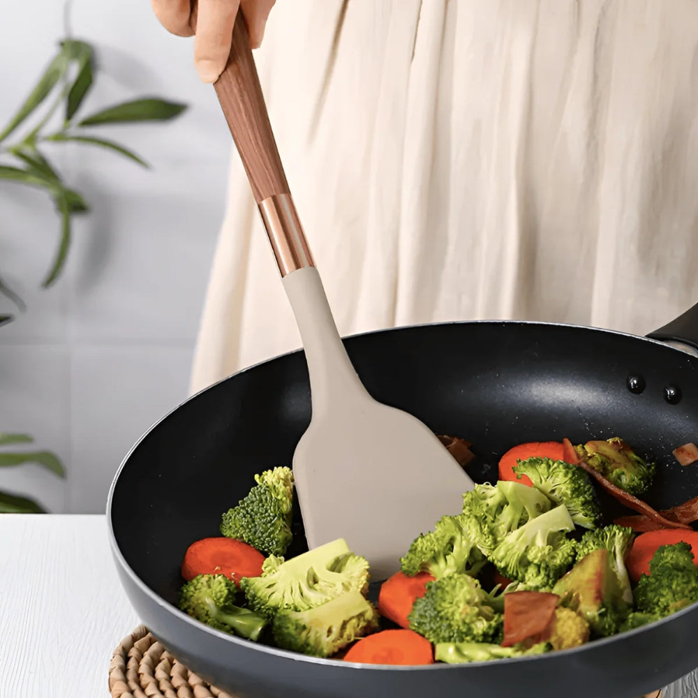 10-piece silicone cooking utensils set in vibrant colors, featuring heat-resistant tools like spatulas, spoons, and tongs. Ergonomic design ensures comfort 3