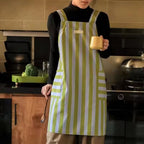 Stylish striped kitchen apron in a vibrant color palette, made from a soft microfiber blend. Features convenient pockets for utensils and tools, perfect for cooking and 0