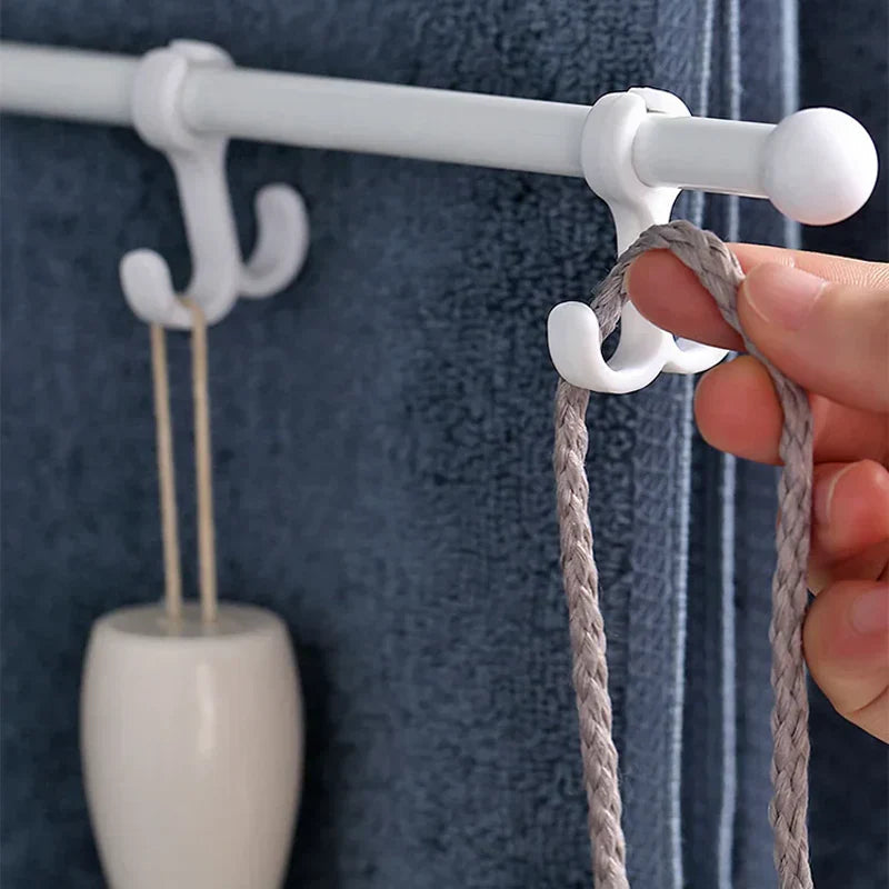 Space-saving swivel towel rack made of durable ABS plastic, featuring a sleek modern design. Ideal for bathrooms, it offers multiple arms for hanging towels, finished 1