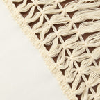 Set of two throw pillows featuring soft fabric in neutral tones, accented with playful tassels. Each pillow measures 18 × 18 inches, perfect for 1