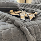 Cozy throw blanket in soft polyester featuring a modern square texture, perfect for enhancing bedroom decor. Available in queen and king sizes, this versatile blanket adds 2