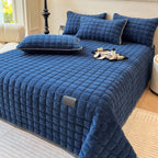 Soft polyester throw blanket featuring a modern square texture, perfect for cozy bedroom decor. Available in queen and king sizes, it adds warmth and style with its 7