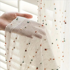 Sheer tulle curtain in a microfiber and cotton blend, featuring vibrant rainbow embroidery. Measures 50 × 84 inches, perfect for adding a colorful 0