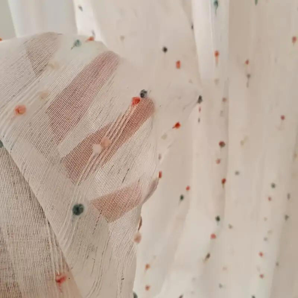 Sheer tulle curtain featuring colorful rainbow embroidery, made from a soft microfiber and cotton blend. Measures 50 × 84 inches, perfect for adding 2