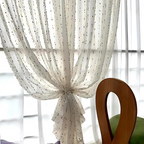 Sheer tulle curtain in a vibrant microfiber and cotton blend, featuring a colorful rainbow embroidery. Measures 50 × 84 inches, perfect for adding 5