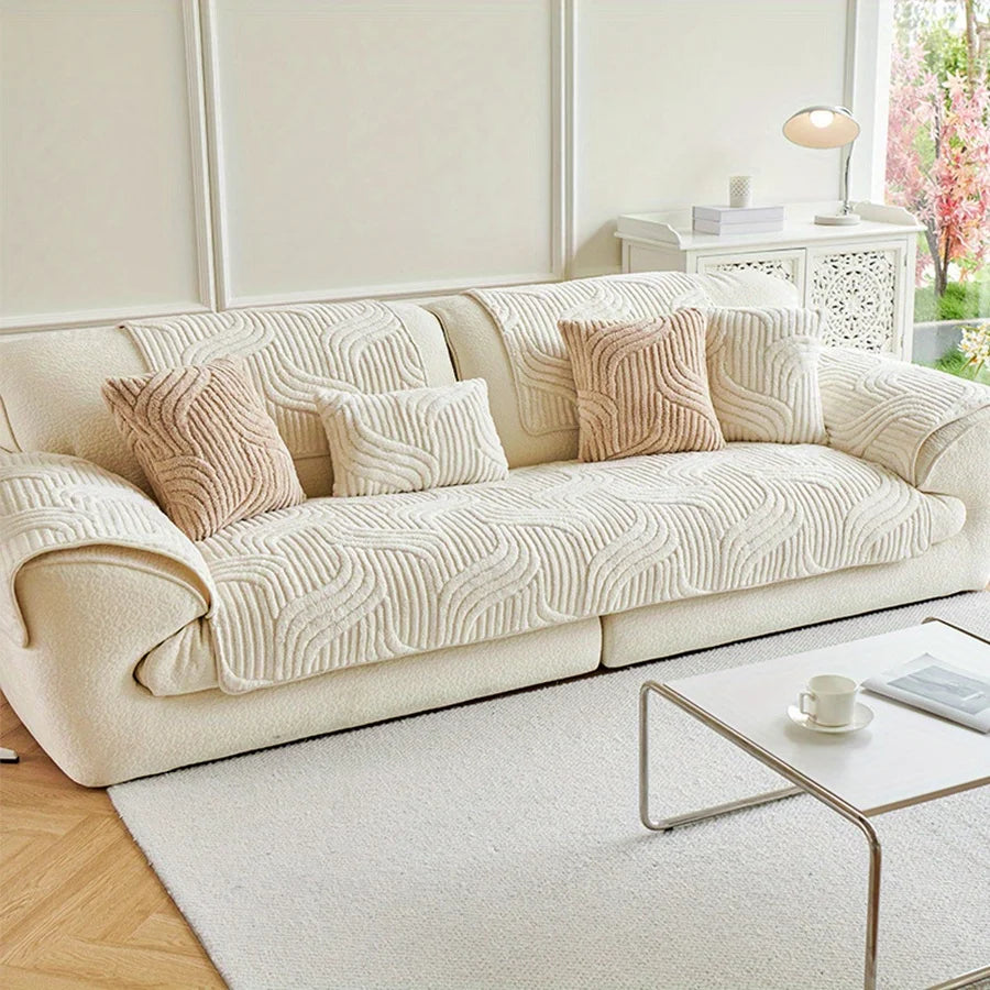 Cream velvet striped sofa cover designed to protect couches, featuring a non-slip backing for secure fit. Ideal for adding a touch of elegance while safeguarding furniture from 2