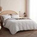 White cotton duvet cover set featuring a soft waffle texture, designed for both King and Queen sizes. The set adds a cozy and modern touch to any bedroom 0