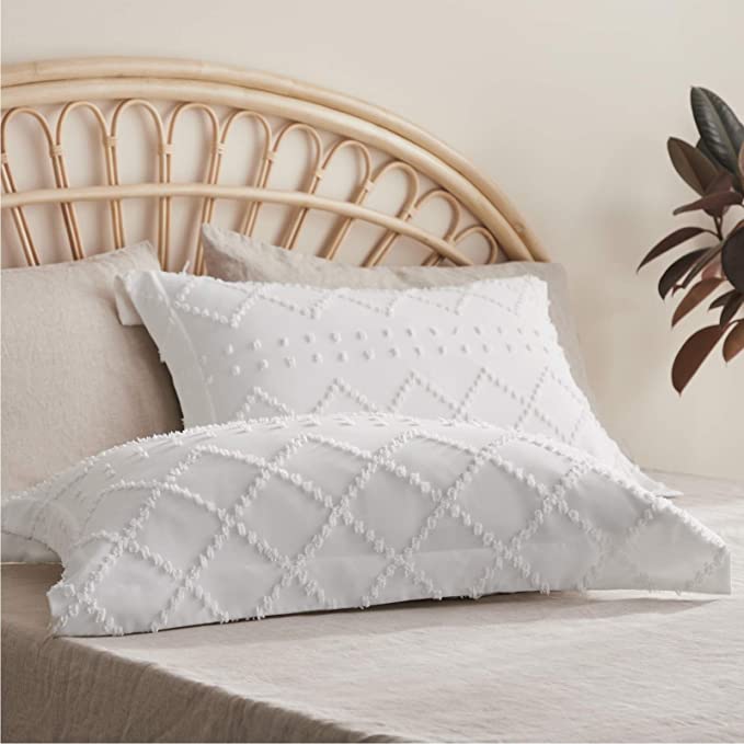 White cotton duvet cover set featuring a soft waffle texture, designed for both King and Queen sizes. The set adds a cozy and modern touch to any bedroom 2