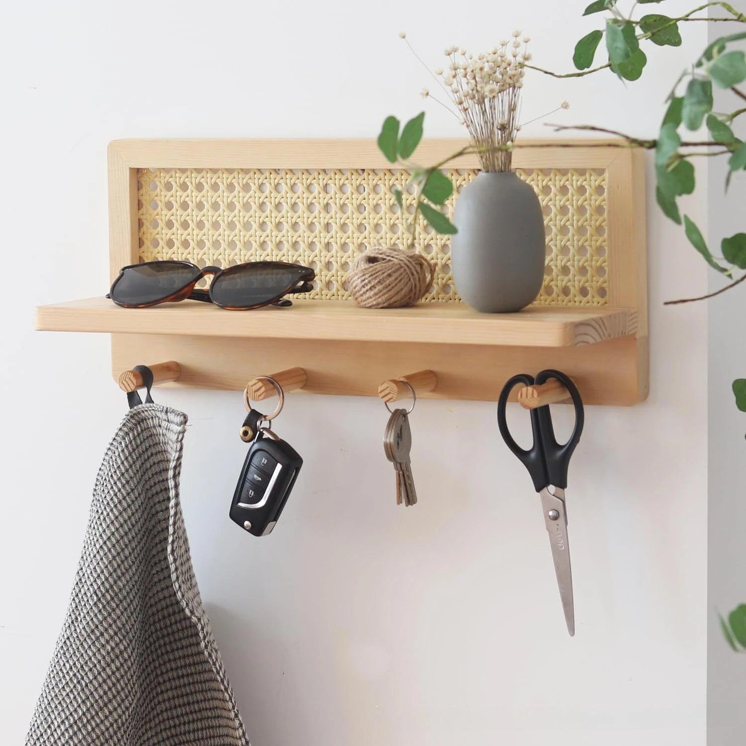 Modern minimalist wood rattan wall shelf featuring a natural finish, ideal for home decor. The shelf combines functionality and style, perfect for displaying plants or small 0