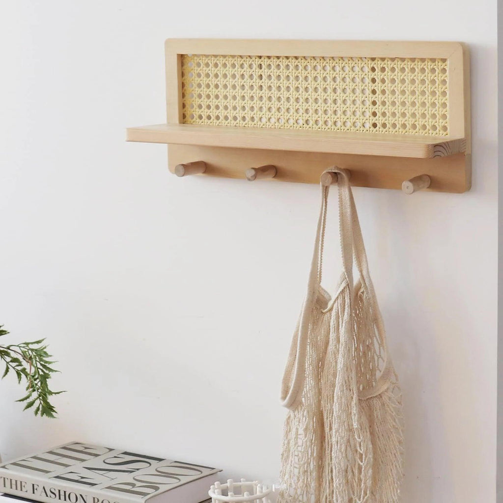 Modern minimalist wood rattan wall shelf featuring a natural finish, ideal for home decor. The shelf combines functionality and style, perfect for displaying plants or small 2