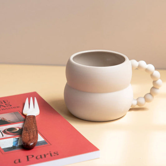 Elegant Scandinavian-Style Mug with Unique Pom-Pom Handle