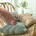 Dear Hazel microfiber cushion covers in red, grey, brown, and black with a chevron pattern and hidden zipper.