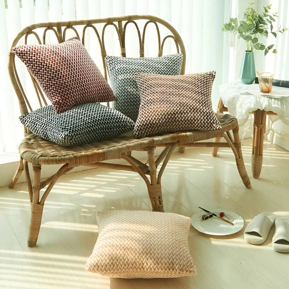 Dear Hazel chevron pattern cushion covers in red, grey, brown, and black microfiber with hidden zippers.