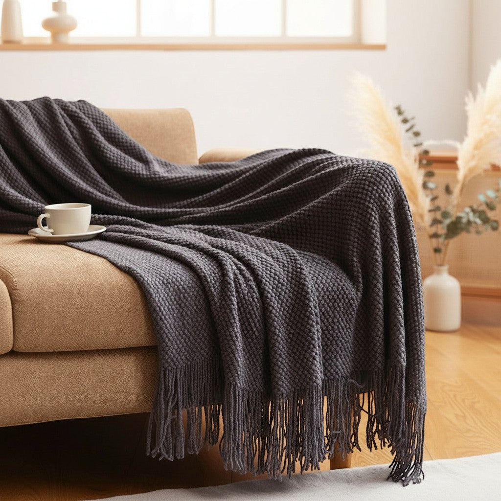 Dear Hazel dark grey knit blanket with fringe, Scandinavian design, soft yarn, perfect for indoor/outdoor comfort.
