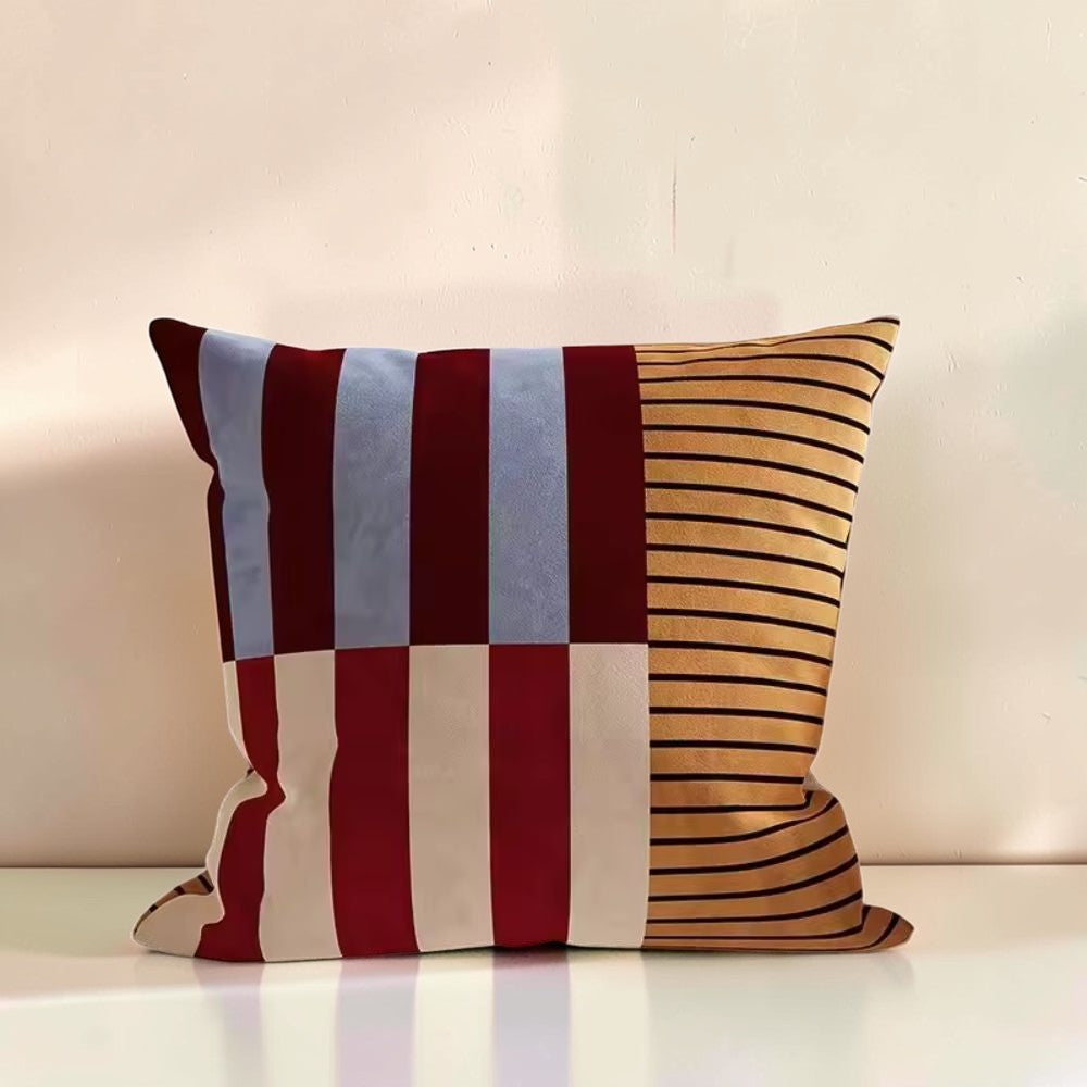 Dear Hazel Mod Blocks striped cushion cover in microfiber blend, featuring red, blue, cream, and gold stripes with an invisible zipper.