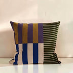 Dear Hazel Mod Blocks striped cushion cover in microfiber blend, featuring purple, gold, blue, and green stripes with an invisible zipper.