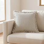 Dear Hazel Scandi-style cushion cover with navy stripes, fringed edges, and cotton-linen blend. 18x18 inches.