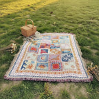 Dear Hazel large microfiber picnic blanket with sun, moon, and wave patterns and fringe trim.